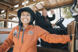 tour guide and trolley driver smiling
