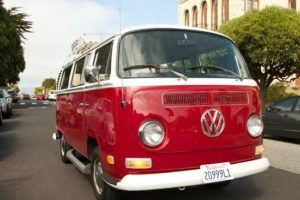 red vw bus with california plates