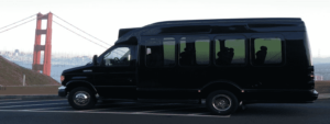 edited image of black minibus in front of golden gate