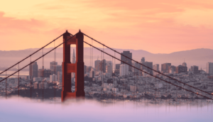 sf at sunset and the golden gate peaking through the clouds