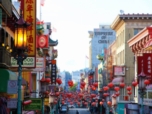 brightly colored chinatown street with red lanterns