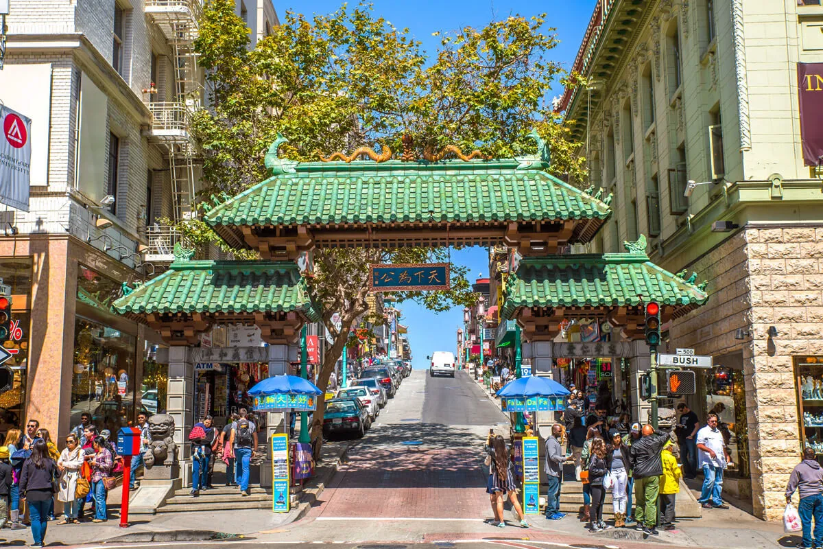 San Francisco Chinatown entrance with crowds of visitors. Entrance gate to San Francisco’s Chinatown with many people walking around.