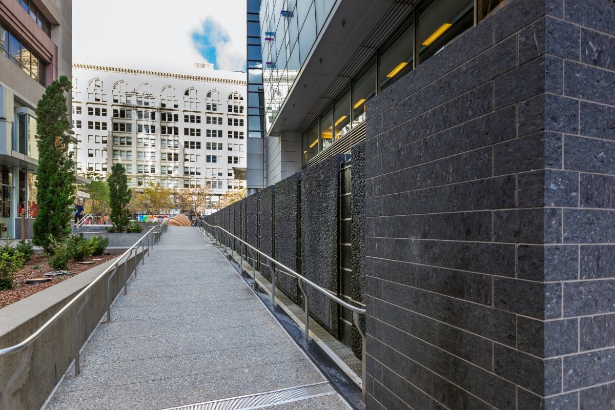 Modern pedestrian walkway between contemporary architecture in downtown San Francisco with landscaped planters