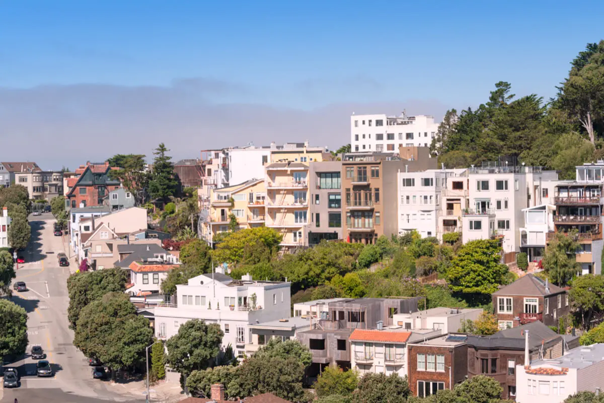 Residential street with houses and greenery in San Francisco’s Haight-Ashbury neighborhood.