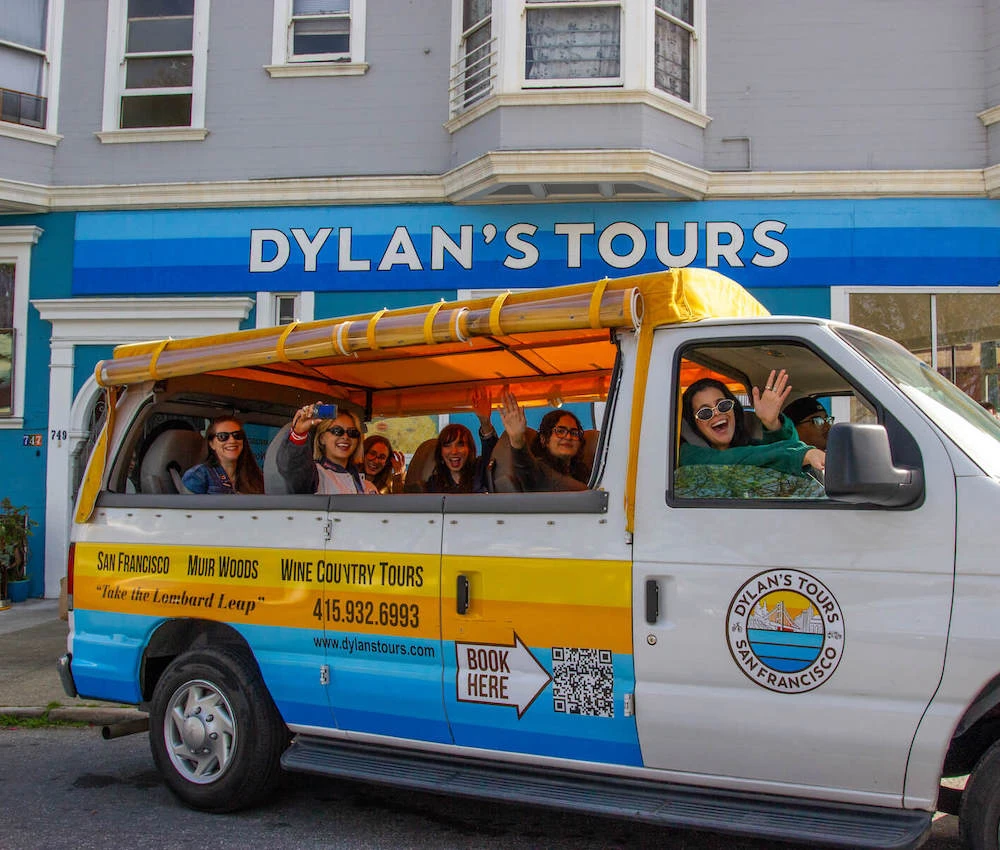 SF open-air tour van with excited passengers