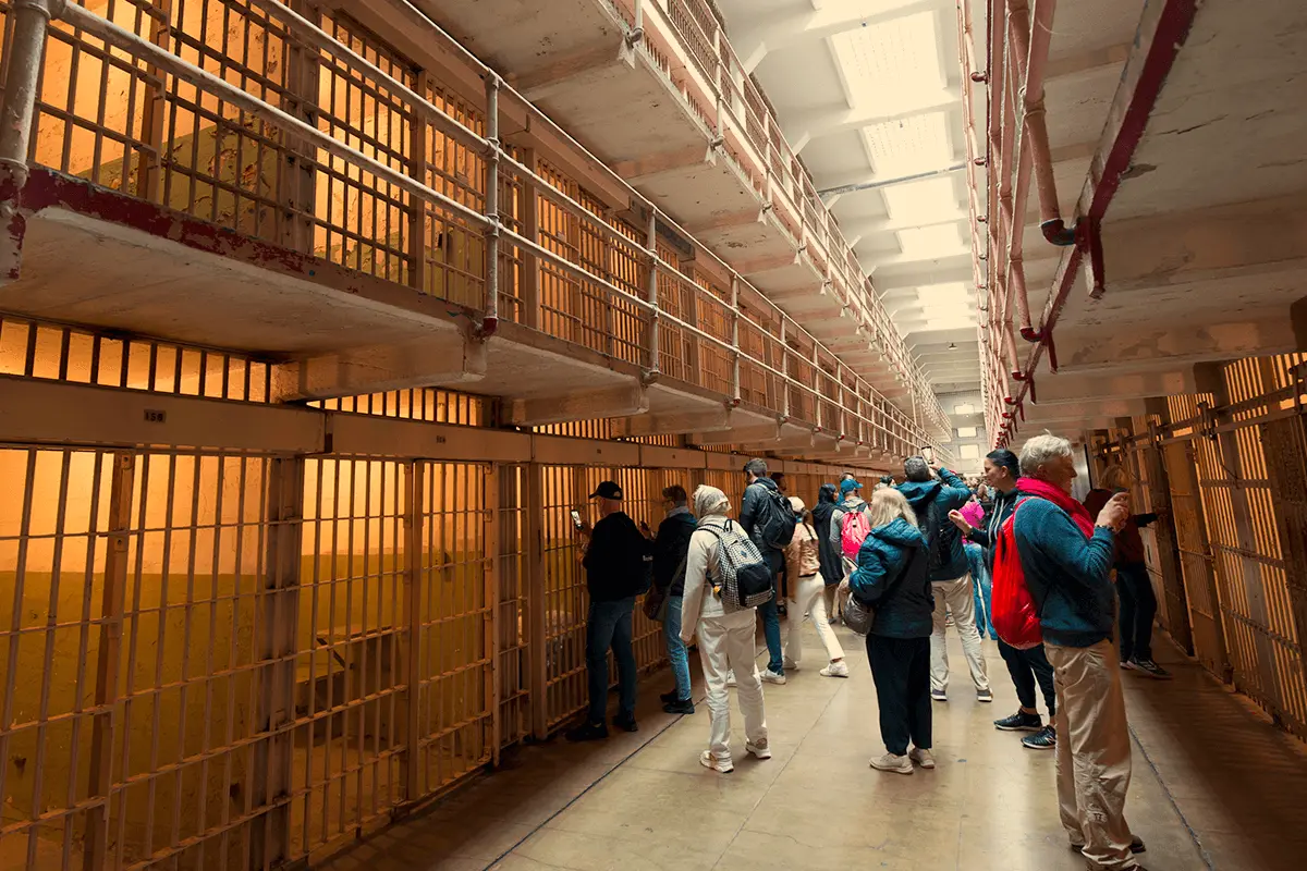 Visitors touring the historic cell blocks inside Alcatraz prison