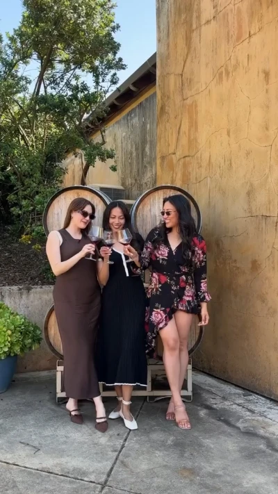 Wine barrel backdrop toast Dylan's Tours winery